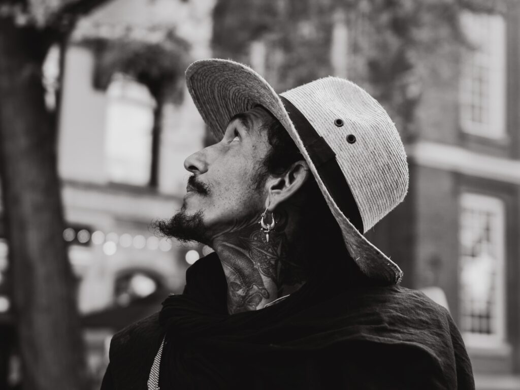 Govinda el Pirata, headshot in Amsterdam, natural light photoshoot, black and white photography, a Caribbean man in Amsterdam, Mexico warmth